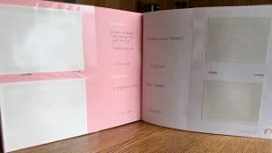 Open baby book with four faded ultrasound prints from 2007 that are now almost blank, next to handwritten notes like “Sucking your thumb!”